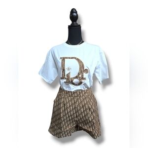 White Graphic T-Shirt and Brown Patterned Shorts